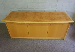 A modern bow-front credenza or serving cabinet, by Hands of Wycombe, circa 2000, with a burr