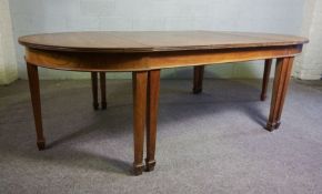 A vintage oak extending dining or serving table, (used as a textile cutting table a famous