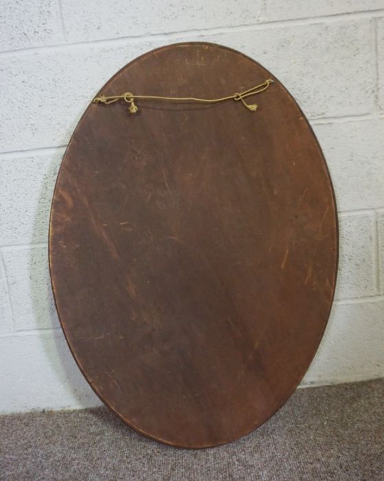 An Edwardian oval mirror on stand, with curved supports, 73cm high, 82cm wide; and another oval - Image 5 of 10