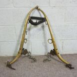 A pair of heavy horse brass and iron harness brackets, marked ‘Solid Brass Warranted’ 28 8QA, with