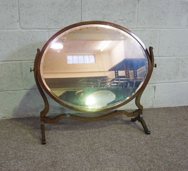 An Edwardian oval mirror on stand, with curved supports, 73cm high, 82cm wide; and another oval - Image 7 of 10
