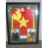 Grand National Interest: A framed racing silk, signed by Richard Dunwoody, the red and yellow ‘silk’