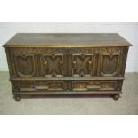 A William III oak coffer, early 18th century, the geometric panelled front inscribed ‘K.B 1701’,