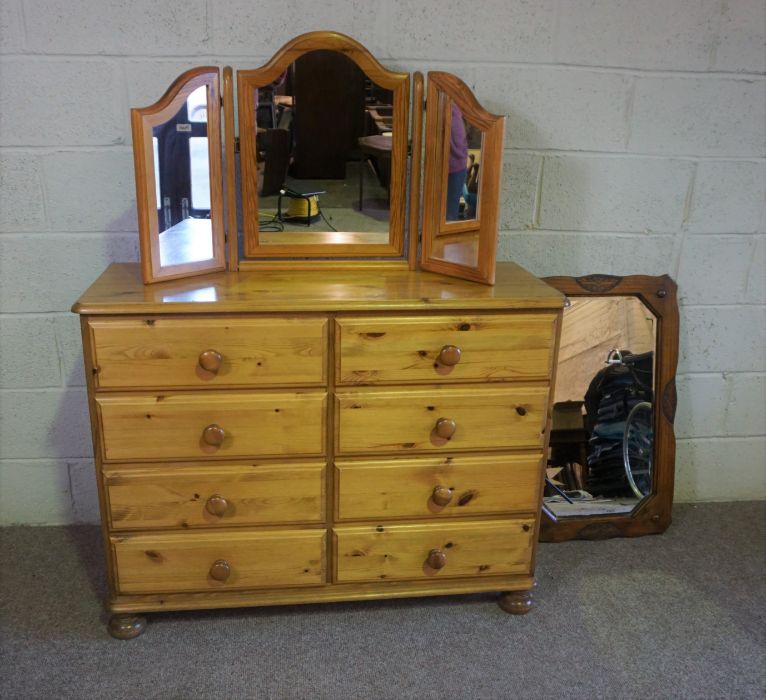 A modern pine chest of drawers, 85cm high, 110cm wide; together with a pine framed folding