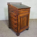 A fine George IV rosewood sliding top Davenport, attributed to Gillows of Lancaster, with a