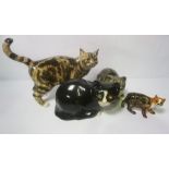 Four novely pottery cats, modelled naturalistically
