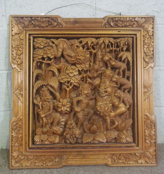 An Indian carved hardwood wall panel, probably depicting Kali and attendants, 20th century, 77cm