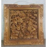 An Indian carved hardwood wall panel, probably depicting Kali and attendants, 20th century, 77cm
