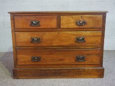 An Edwardian walnut chest of drawers, with two short and two long drawers, 78cm high, 106cm wide