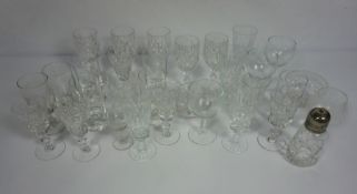 A large assortment glassware, including champagne bowls, flutes and a caster with plated top (a