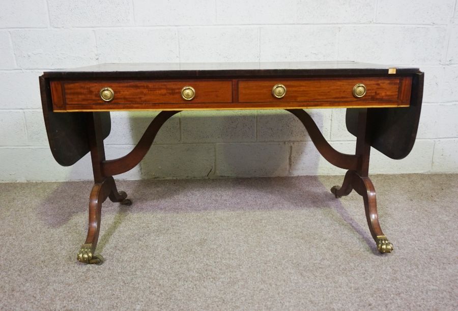 A Regency mahogany sofa table, circa 1810, with a drop leaf cross-banded top, over two drawers and - Image 2 of 6