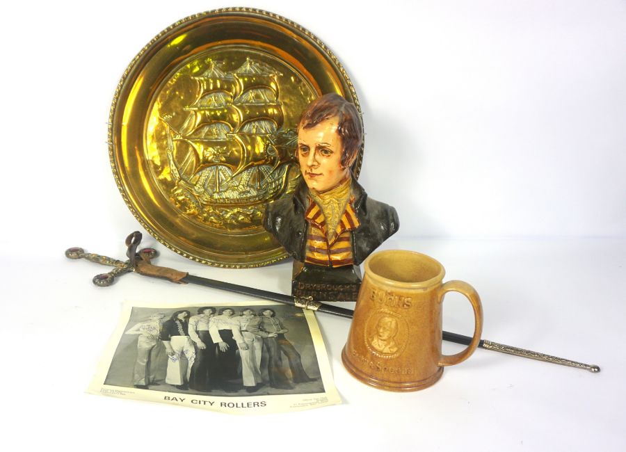 A box of assorted items, including a decorative small sword, A “Dryborough’s Burns’ Ale” bust of