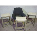 Three vintage bar stools, with limed oak frames, 70cm high; together with a small modern armchair (