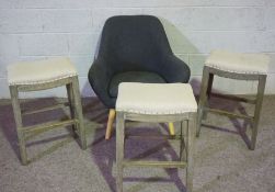 Three vintage bar stools, with limed oak frames, 70cm high; together with a small modern armchair (