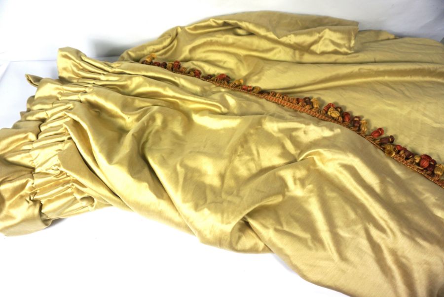 A pair of ‘antique gold silk’ style curtains, with heavy interlining and multi-colour tasselled - Image 2 of 3