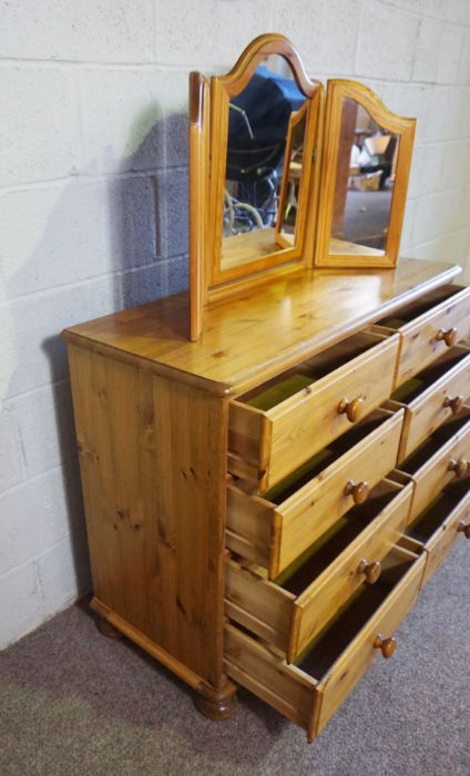 A modern pine chest of drawers, 85cm high, 110cm wide; together with a pine framed folding - Image 7 of 7