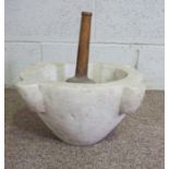 A large stone mortar, 40cm wide; together with a large turned pestle