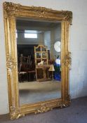 A very large George III style wall mirror, modern, circa 2000, with a bevelled rectangular plate set