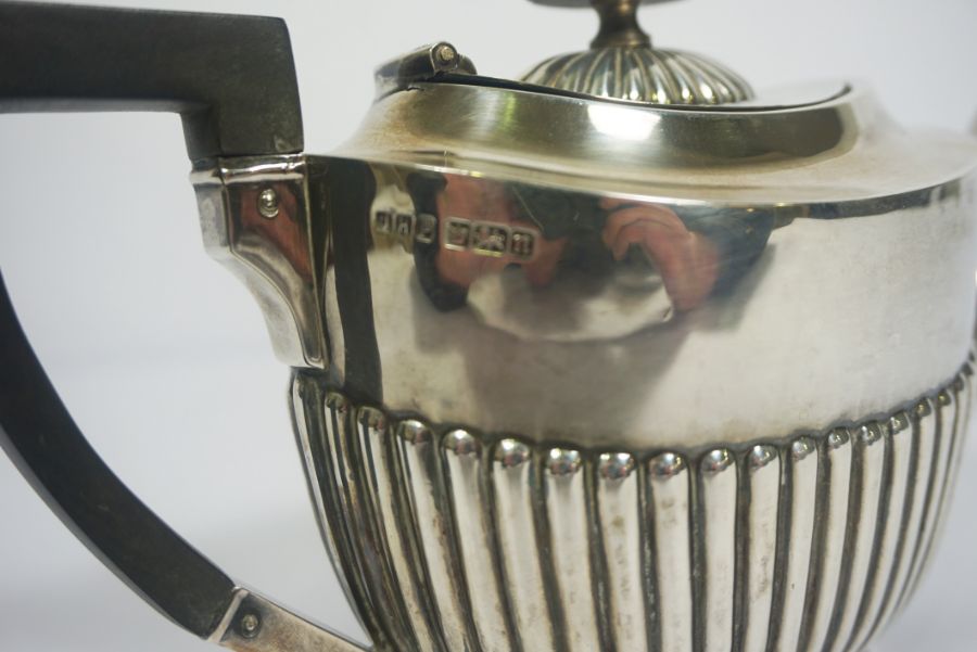An Edwardian silver teapot, hallmarked Sheffield 1905, of oval part fluted form, with ebonized - Image 6 of 6