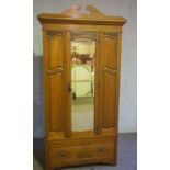 An Edwardian walnut single wardrobe, with mirrored door, 212cm high, 100cm wide