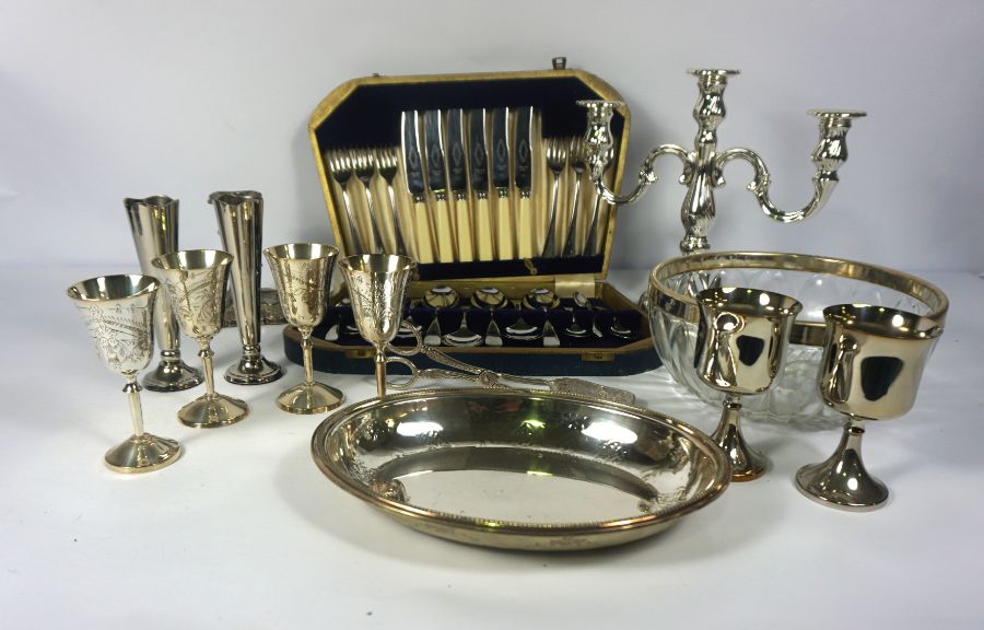 A large assortment of silver plate, including trays, a tea set, serving dishes etc (a lot)