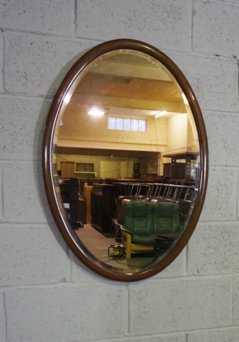 An Edwardian oval mirror on stand, with curved supports, 73cm high, 82cm wide; and another oval - Image 2 of 10
