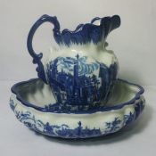 A large Victorian style wash basin and ewer with blue and white classical decoration, bowl 40cm