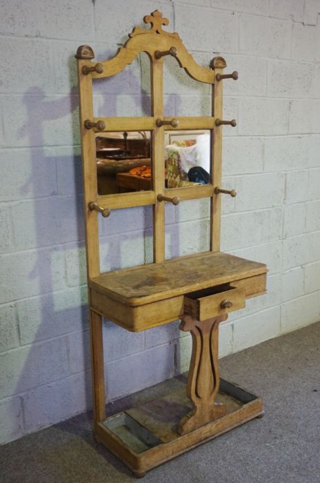 A late Victorian oak hall stand, circa 1900, with an arched top, with nine hat hooks over a small - Image 4 of 4
