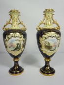A pair of Coalport porcelain companion vases, each decorated with a lakeside view on a Royal blue