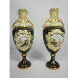 A pair of Coalport porcelain companion vases, each decorated with a lakeside view on a Royal blue