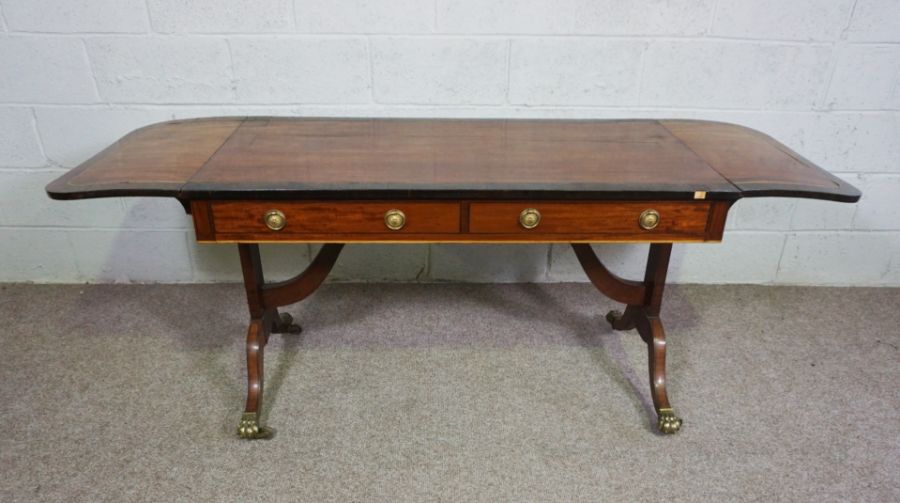 A Regency mahogany sofa table, circa 1810, with a drop leaf cross-banded top, over two drawers and - Image 5 of 6