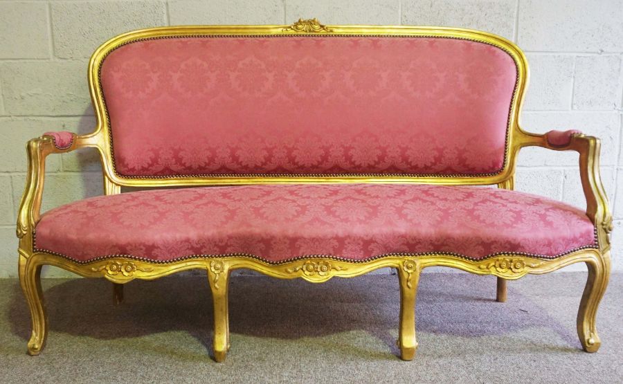 A George III style giltwood framed settee (or Canape), 20th century revival, with an arched