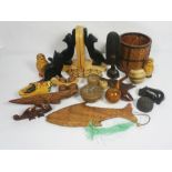 A collection of assorted wooden novelty items, including cat bookends, a carved hardwood bowl,