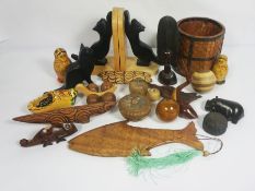 A collection of assorted wooden novelty items, including cat bookends, a carved hardwood bowl,