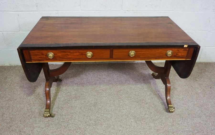 A Regency mahogany sofa table, circa 1810, with a drop leaf cross-banded top, over two drawers and - Image 3 of 6