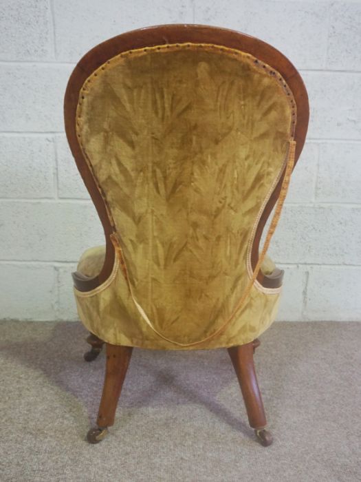 A Victorian mahogany framed spoon-backed nursing chair, circa 1860, currently upholstered in dark - Image 4 of 4