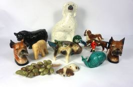 A wild assortment of animal figurines, including a Beswick King Charles Cavalier spaniel, a