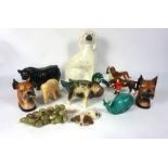 A wild assortment of animal figurines, including a Beswick King Charles Cavalier spaniel, a