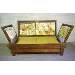 A vintage Parker Knoll oak framed adjustable settee, circa 1940-50, with unusual slide out sides and