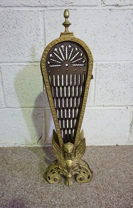 A Victorian serpentine brass fretwork fire curb, 140cm long; and brass and iron spark guard (2)