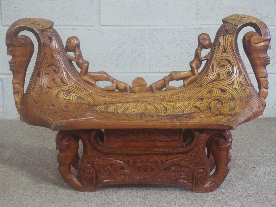 A Congolese style carved hardwood ceremonial chest, African, modern, 20th century, in the form of