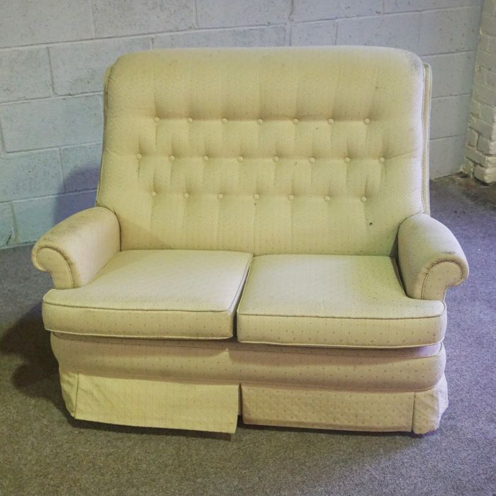 A modern two seat sofa, with beige upholstery, together with a small upholstered ottoman (2) - Image 2 of 3