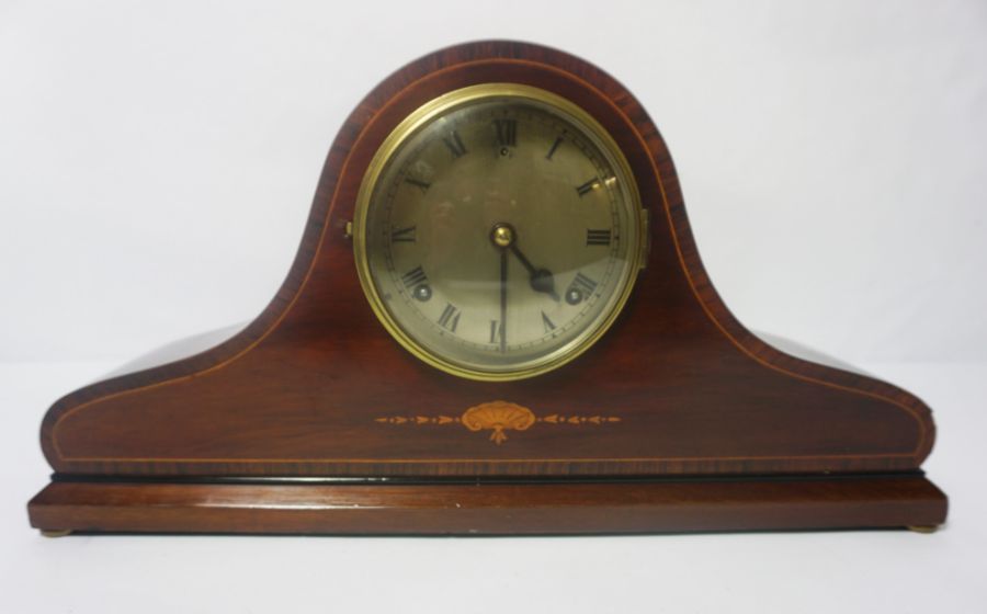 An Edwardian mahogany cased mantel clock, with domed top, 52cm wide; together with vintage style