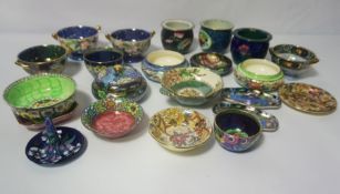 A collection of Maling lustre ware, including assorted small jars, trays and similar, decorated with