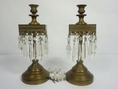 A pair of brass candlestick lustres, in 17th revival, with square collars and suspended clear lustre