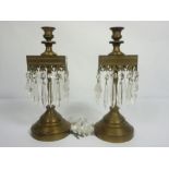 A pair of brass candlestick lustres, in 17th revival, with square collars and suspended clear lustre