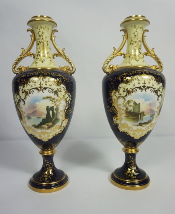 A pair of Coalport porcelain companion vases, each decorated with a lakeside view on a Royal blue - Image 2 of 6