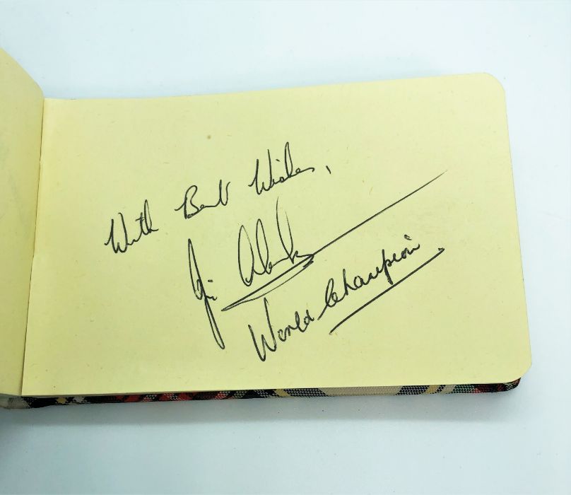 Jim Clark, OBE., Formula 1 motor racing interest: A small autograph book containing his autograph,