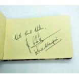 Jim Clark, OBE., Formula 1 motor racing interest: A small autograph book containing his autograph,