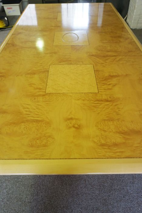 A modern burr veneered boardroom table, with a rectangular top, utility port and set on angled - Image 2 of 2